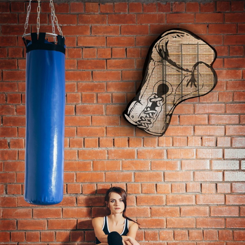 wall mirror carved in the shape of a boxing glove