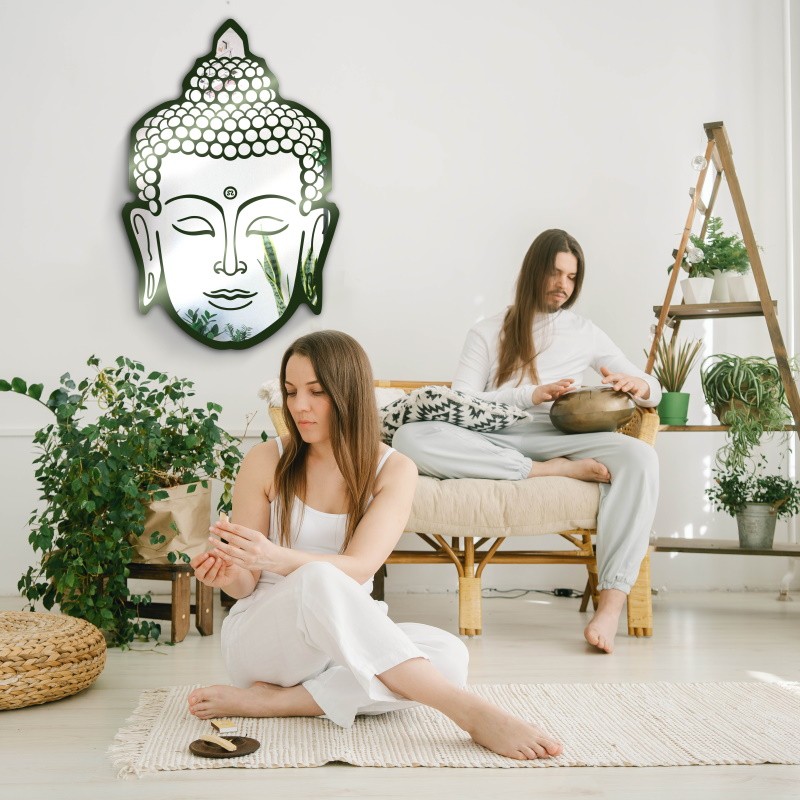 carved wall mirror depicting Buddha